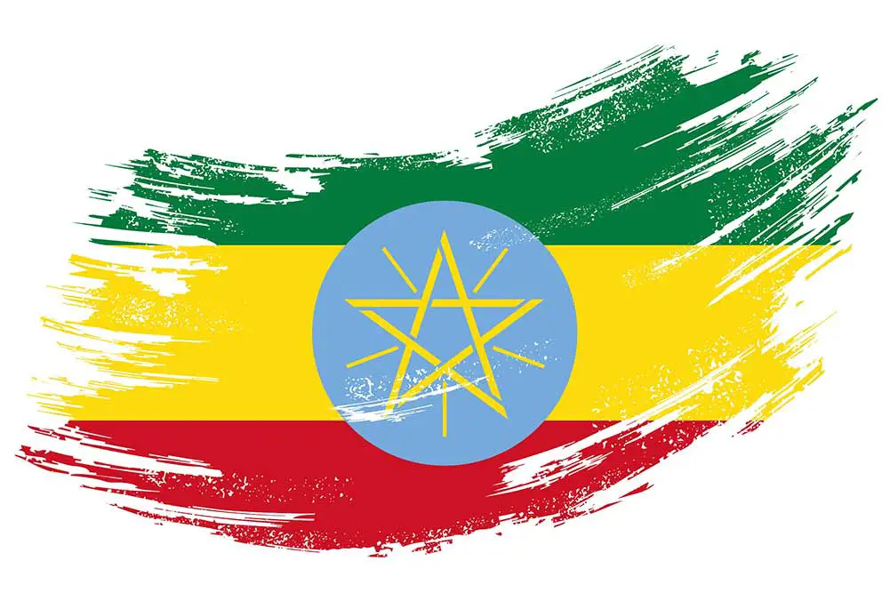 Grunge-bürstenhintergrund der äthiopischen flagge. vektor-illustration.