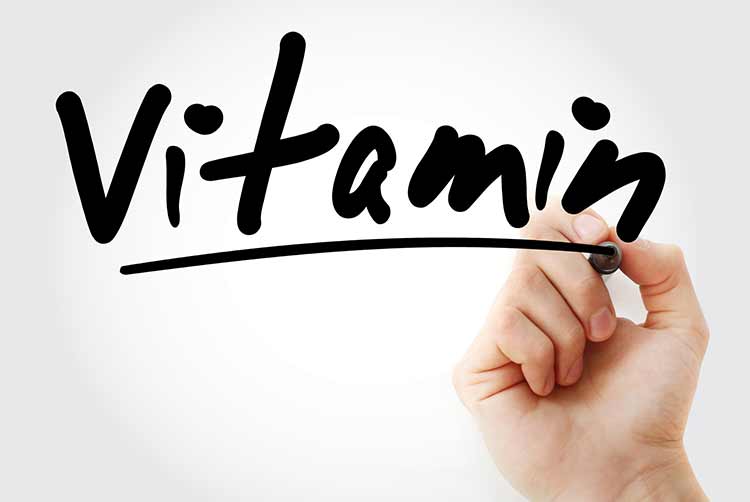 Vitamintext mit marker, hintergrund des gesundheitskonzepts